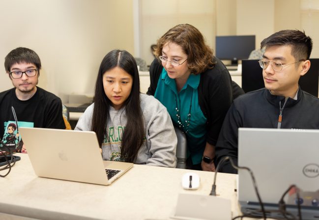 Cori Faklaris, assistant professor of software and information systems, encourages students to view AI as a tool for mining complex information.